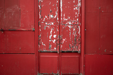 red wooden closed store facade at Paris, France