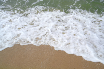White sandy beach background and sea