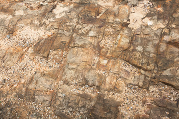 Nostalgic yellow rock texture and messy gravel