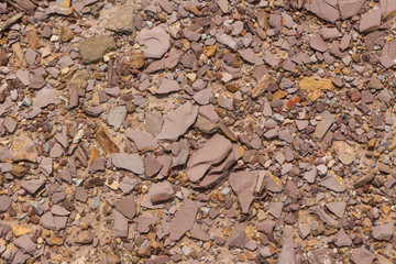 Reddish brown stacked rock and gravel background, flaky stone background material