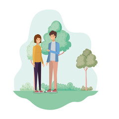 young couple in landscape with trees and plants