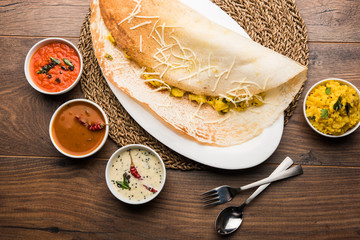 cheese masala dosa recipe with sambar and chutney, selective focus
