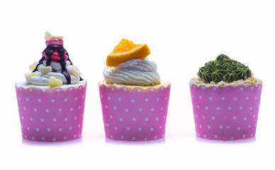 colorful cupcakes isolated on a white background