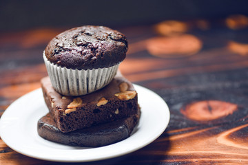 chocolate cupcake on the Chocolate Brownie on white palte