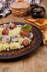 Stewed vegetables with sausages