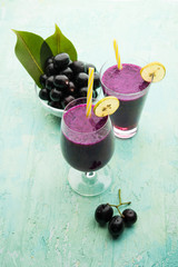 Juice of jamun fruit in a glass also called as java plum, jambolan plum, jambhul, syzygium cumini