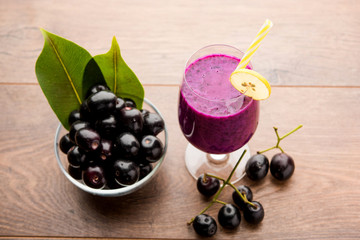 Juice of jamun fruit in a glass also called as java plum, jambolan plum, jambhul, syzygium cumini