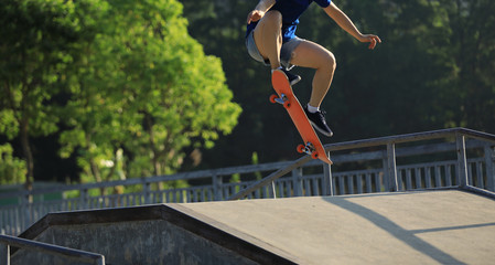 Skateboarder skateboarding on skate park