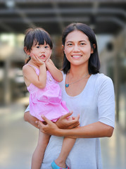 Fototapeta premium Happy loving family. Mother and her daughter child girl playing and hugging