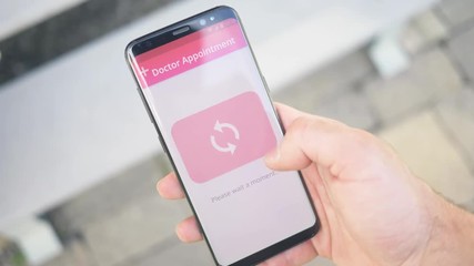 Using an online appointment app to schedule a rendezvous to the doctor on a smartphone screen.