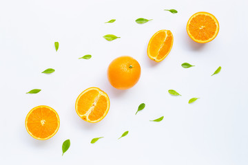 Fresh orange citrus fruit with leaves isolated on white background.