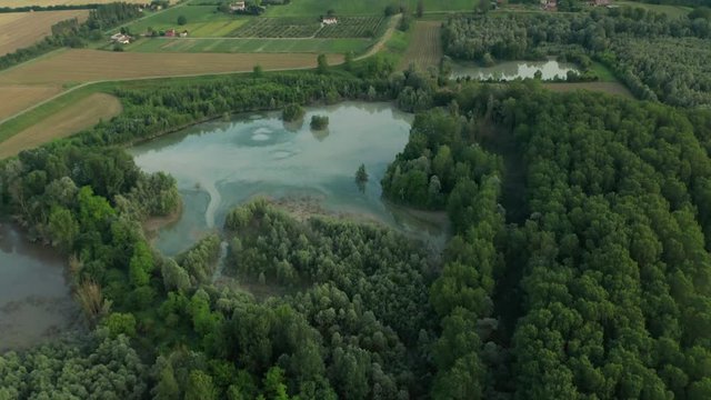 4K Aerial : Fast cinematic revealing shot of a rural landscape