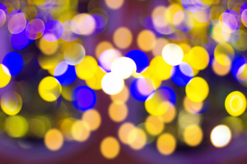 Blur - bokeh Decorative outdoor string lights hanging on tree in the garden at night time