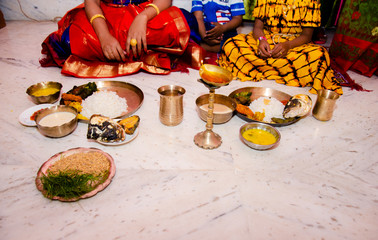 Traditional Indian food in brass plate and cup in Indian festival