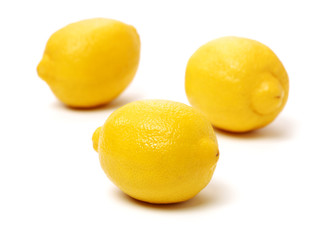 Ripe lemons on white background