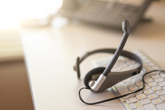 headset headset phone and keyboard talk, support, communication, call center and customer service, business concept