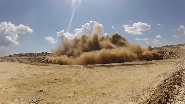 Detonation on a construction site, mountain, hollow alpine. Strong explosion.