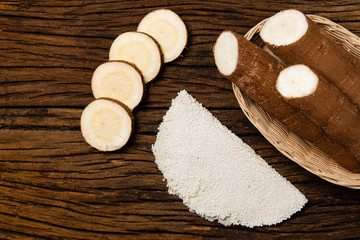 Beiju of tapioca, cassava-based dish typical of the northeastern region of Brazil, now consumed in the whole country on old wooden background.