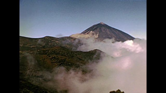 peak with fog of the Teide Volcano mountain in Teide National Park. Historical archival of Tenerife island of Spain in Africa in 1970s