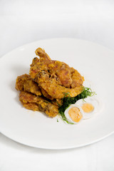 Crisp fried shrimps tempura with egg. Seafood tempura cuisine dish.