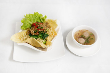 Cwie mie or cui mie, asian noodles with chicken, vegetable, and meatballs in a bowl