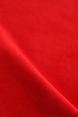 velvet fabric texture background red color. Christmas festive baskground. expensive luxury, material, cloth.Copy space.