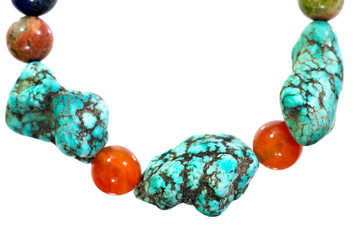 Turquoise, Unakite, lapis lazuli, Carnelian and Amethyst  bracelet isolated on white background.