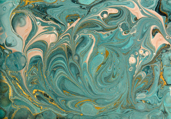 Blue and gold marbling pattern. Golden marble liquid texture.