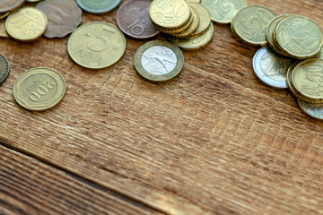 coins Pile pack heap on a wooden background with space for an inscription copy space mock up selective focus close up