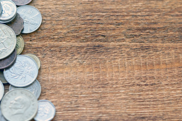 coins Pile pack heap on a wooden background with space for an inscription copy space mock up selective focus close up
