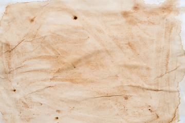 Brown splotch over white surface. Stained paper abstract art background. Spilled coffee effect....