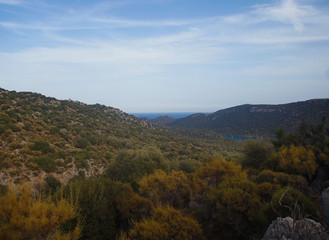 Fototapeta premium Mountain southern summer landscape. View of the green hills and cliffs.