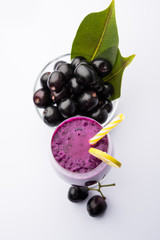 Juice of jamun fruit in a glass also called as java plum, jambolan plum, jambhul, syzygium cumini