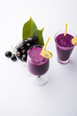 Juice of jamun fruit in a glass also called as java plum, jambolan plum, jambhul, syzygium cumini