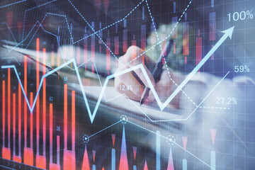 Financial forex graph displayed on hands taking notes background. Concept of research. Multi exposure