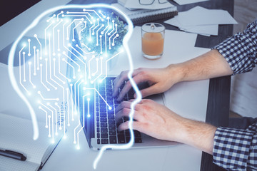 Man with computer background with brain theme hologram. Concept of brainstorm. Double exposure.