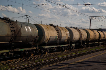 Fototapeta na wymiar a train loaded with cisterns goes by rail