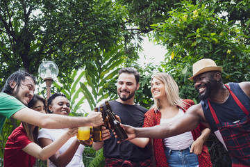 Fototapeta premium Cheers, Group of people cheering with beer for drinking in nature outdoor as summer lifestyle