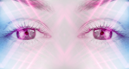 Eyes of   female on a bright abstract background with holograms