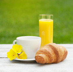 Coffee, orange juice and croissant