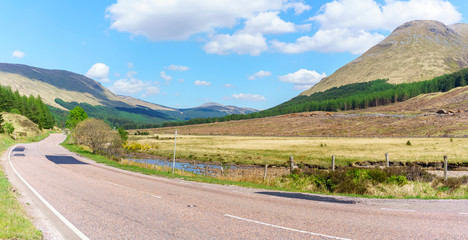 Panoramic scenery of the classic Highland journeys on major road in Scotland with blue sky in summer , Argyll and Bute