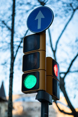 Close view of a green traffic light with blurred background