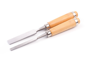 a set of chisels with wooden handle isolated .