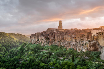 PITIGLIANO, TUSCANY, ITALY - JUNE 15, 2019 - View of Pitigliano town at sunset. Picturesque and unusual - built on tuff, tufaceous volcanic rock.