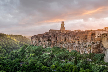 Fototapeta premium PITIGLIANO, TUSCANY, ITALY - JUNE 15, 2019 - View of Pitigliano town at sunset. Picturesque and unusual - built on tuff, tufaceous volcanic rock.