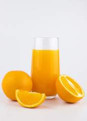 still life photo of orange juice, orange smoothie in glass on white background.