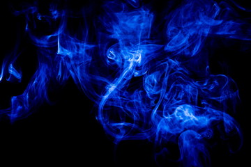 Blue smoke on black background