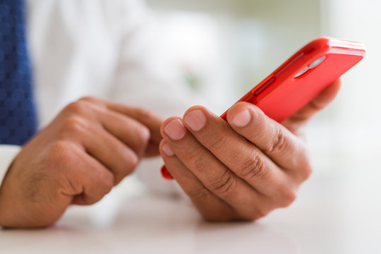 Close up of business man hands using smarpthone