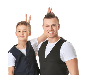 Portrait of funny father and son on white background