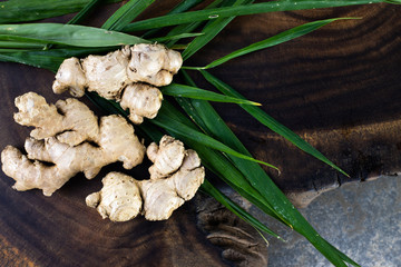 Farm fresh green peppercorns on wooden background